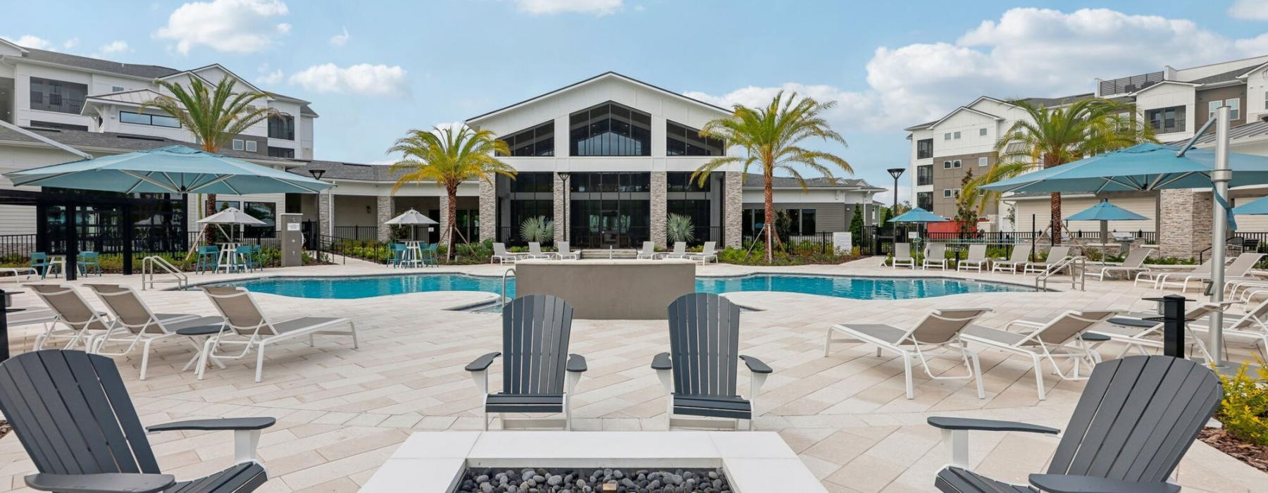 a pool with chairs around it