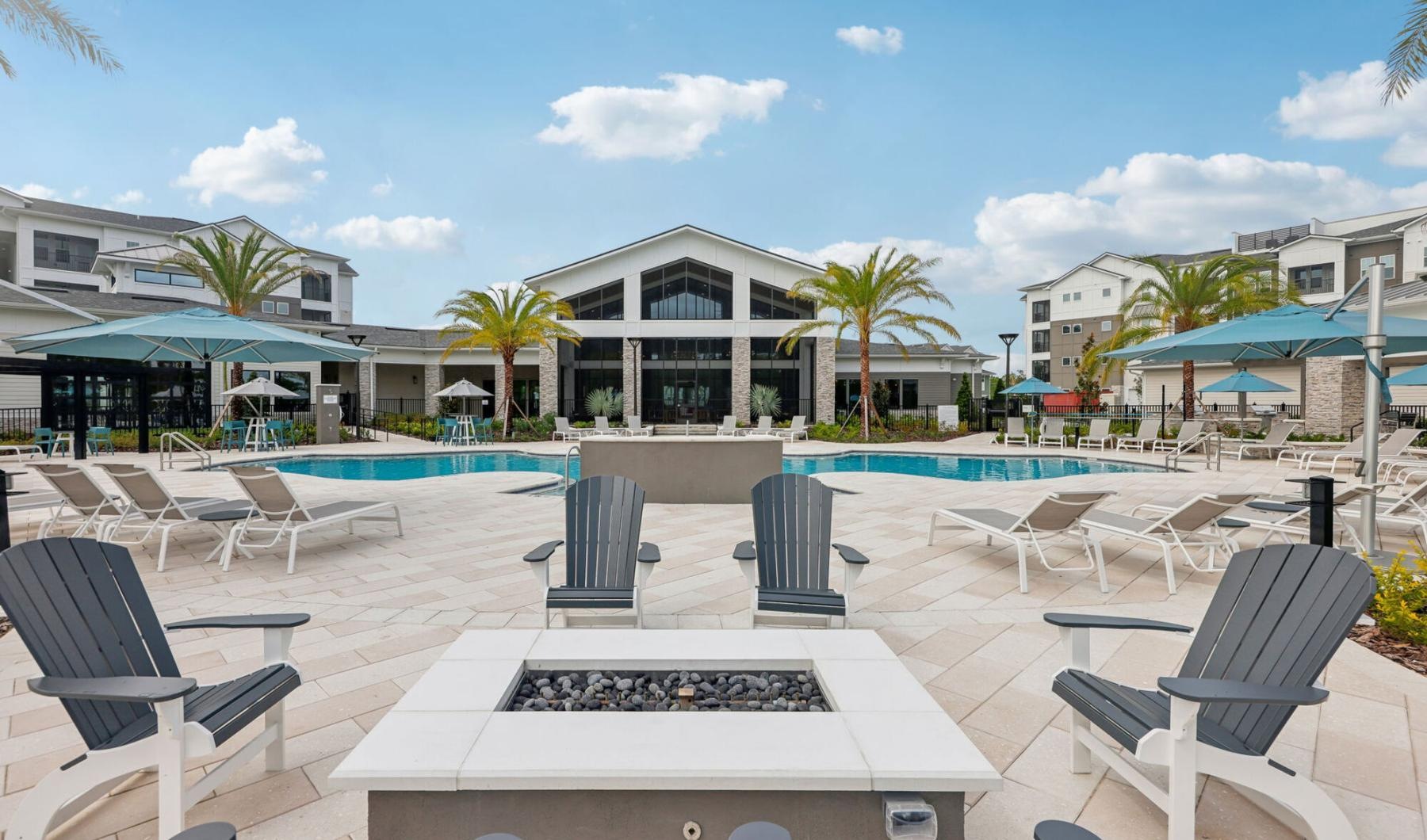 a pool with chairs around it