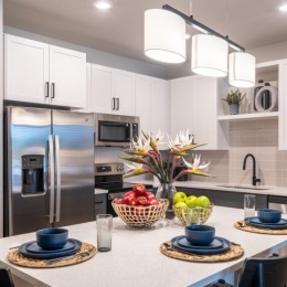 a kitchen with white cabinets