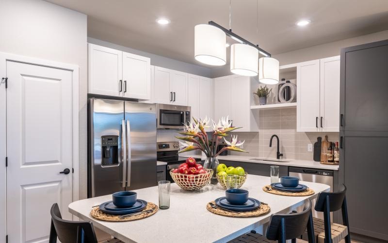 a kitchen with white cabinets